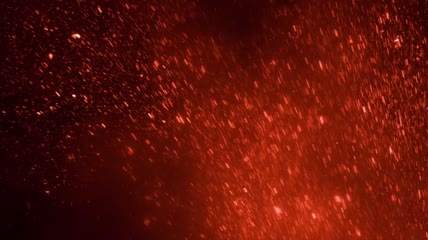 燃烧的熔岩颗粒在空气中跳跃视频